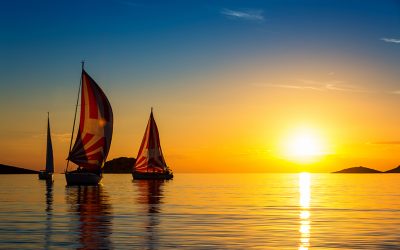 Sailboats formation at sunset Formation of three sailboats at sunset.